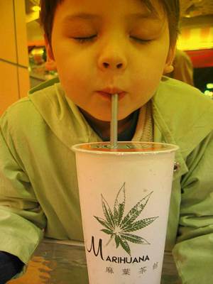 Child Drinking out of a Marijuana Cup