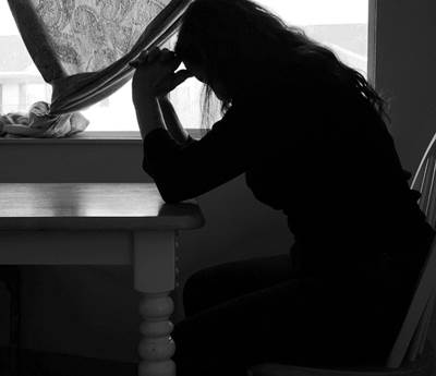 Silhouette of a Woman Under Depression