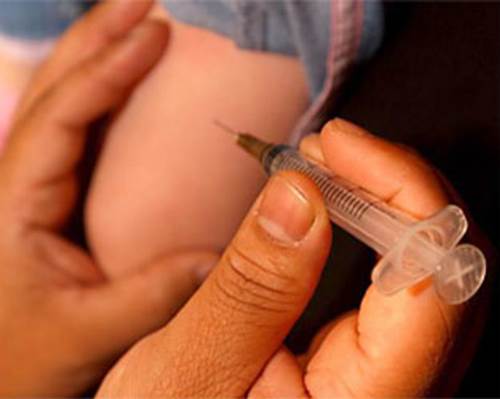 A Vaccine Shot Being Administered