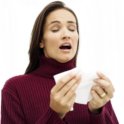Woman Sneezing due to Allergies