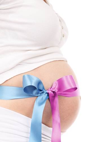 Blue & Pink Ribbon Knot on a Pregnant Woman's Belly